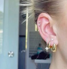 a close up of a person with ear piercings