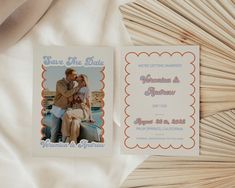 a wedding save the date card on top of a bed