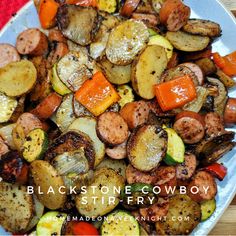 a white plate topped with potatoes and carrots