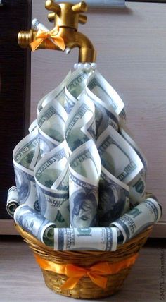 a basket filled with money sitting on top of a counter