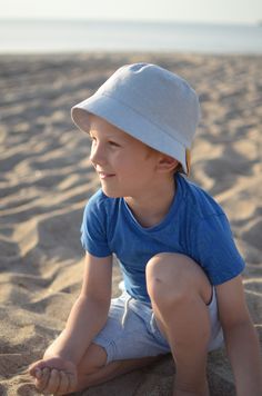 "Linen and cotton bluish sun hat is created for all the boys. It will look pretty in a city, nature... and perhaps anywhere. This summer bucket hat is as pretty as it is practical. This cute design has a brim, perfect for protecting kid's eyes and face from the sun for hours of outdoor fun. This lovely boys sun hat is fully lined with 55% linen and 45% cotton fabric for the comfort. Sizes of the hat are according the circumference of the head or age. To measure the head of the child use a flexib Summer Bucket Hat, City Nature, Baby Blanket Knitting Pattern, Knitted Baby Blankets, Baby Blanket Pattern, Blanket Knitting Patterns, Summer Bucket, Wrinkle Remover, Outdoor Fun