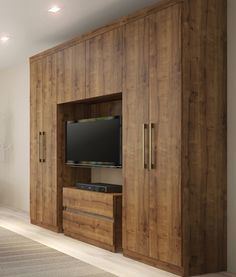 a large wooden entertainment center in a living room