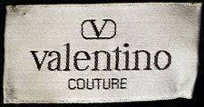 a white and black label with the word valentio couture on it