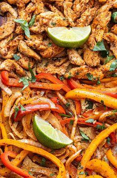 chicken fajita with peppers, onions and cilantro on a sheet pan