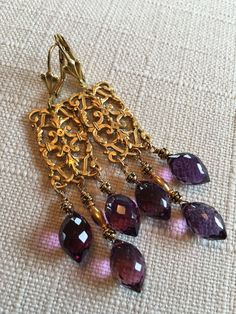 Ornate Byzantine Brass Stamping. Faceted Amethyst Briolettes. Vintage Brass Tubes. Vintage Brass Leverback Closure. Size  :  3 inches.      (7.5 cm) Ornate Purple Dangle Jewelry, Ornate Purple Dangle Earrings, Ornate Purple Drop Earrings, Ornate Purple Pierced Earrings, Ornate Purple Jewelry With Matching Earrings, Elegant Gold Amethyst Chandelier Earrings, Elegant Gold Chandelier Earrings With Amethyst, Handmade Amethyst Chandelier Earrings, Handmade Elegant Amethyst Chandelier Earrings