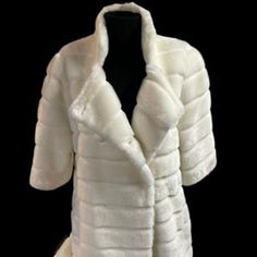 Beautiful pure white faux fur winter coat  Woman's size Large  3/4 length sleeves -perfect for long gloves super stylish! Knee length - or as they called a Car length style Button and tab closure Found with tags still on it, never worn! Button closing  Lined with white satin Elegant and timeless fashion piece Plush and cozy--- this coat has the unusual 3/4 length sleeves. (see picures) Coat is approx. 34 inches long from shoulder. Faux Fur White Coat, Fur White Coat, White Faux Fur Coat, Timeless Fashion Pieces, Winter Fur Coats, Long Gloves, White Coat, White Faux Fur, White Fox