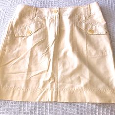 Nwt Ann Taylor Skirt. Has 2 Front Pockets. Extra Button Included. 100% Cotton. Pretty Soft Or Light Yellow. Elegant Button-up Mini Skirt For Spring, Fitted Spring Skort With Button Closure, Fitted Beige Mini Skirt With Buttons, Classic Button-up Spring Skirt, Fitted Button-up Skort For Spring, Classic Spring Skirt With Pockets, Spring Workwear Skort With Buttons, Light Yellow, Ann Taylor Loft