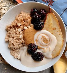 a bowl filled with cereal, fruit and yogurt next to a bag of peanut butter