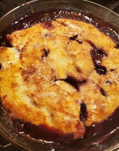 a pan filled with food sitting on top of a stove