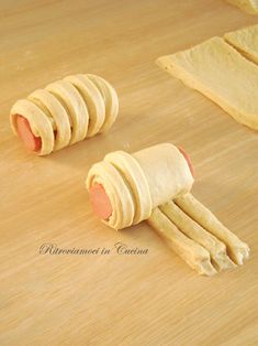 rolled up dough on a cutting board with rolling pin