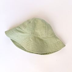 "A mint green linen wide brimmed sun hat that will protect your little beach bum from the sun. The wide brim covers the face, chest and shoulders for maximum sun protection. So let the sun shine! This summer hat will soon become a favorite on your adventures outside. Made from a medium weight mint green linen fabric. Inside liner made of white cotton. This hat has a chin strap with metal snap to help keep the hat on. Brim measures 3.5 inches. HAT SIZES AVAILABLE: 0-3 mos. - 12\" to 14\" head cir Solid Color Cotton Sun Hat For Summer, Cotton Summer Sun Hat, Solid Cotton Summer Sun Hat, Solid Color Cotton Summer Sun Hat, Summer Cotton Sun Hat With Flat Brim, Solid Color Summer Sun Hat One Size, Solid Color Summer Sun Hat With Short Brim, Solid Color Short Brim Summer Sun Hat, Cotton Sun Hat With Curved Brim For Beach Season