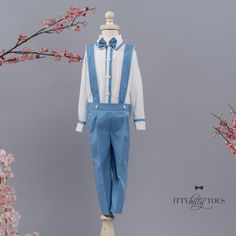 The Miller Suspender Set in White & Blue is a gorgeously tailored suspender set for young boys. It is made with as much attention to detail and luxurious fabrics as gentlemen's suits. The set includes a pair of perfectly pleated slacks, a high-quality cotton shirt, suspenders attached to the pants, and a beautiful double layered bow tie. Your little man will be the best dressed in town! ⦁ Button down shirt, pants, suspenders and bow tie.⦁ 0-6 months to 12 years Don't see what you need?CUSTOM Pleated Slacks, Layered Bow, Blue Suspenders, Suspenders Set, White Cotton Dress, Blue Trim, Gold Dress, Green Velvet, Birthday Outfit