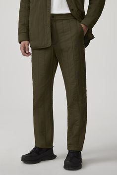 The Carlyle Quilted Pant is made with Nylon Pongee for water-repellent, wind-resistant protection with a smooth, sheen finish. It has an elasticized waistband and zipper fly and is equipped with two front side-entry pockets and a single back welt pocket,  providing optimal comfort with simple aesthetics. The Carlyle Pant is insulated with 100% TENCEL™ Lyocell, a biodegradable fibre made from wood pulp harvested from sustainably managed forests. Journey Boots, Simple Aesthetics, Quilted Pants, The Carlyle, Men Parka, Mens Parka, Snow Pants, Boots And Sneakers, Snow Suit