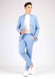 The Ellis Icy Blue Stretch Suit is a fashionable and welcoming piece crafted from a soft powdery blue stretch fabric. This stylish custom made suit provides a bright and clean look, sure to make a statement. Classic Fitted Light Blue Suit, Classic Light Blue Fitted Suit, Classic Blue Pantsuit With Notch Lapel, Classic Blue Semi-formal Pantsuit, Blue Slim Fit Suit With Pressed Crease, Light Blue Notch Lapel Suits For Work, Slim Fit Blue Suit With Pressed Crease, Blue Slim Fit Suits With Pressed Crease, Classic Blue Tailored Pantsuit