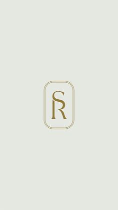 the letter r is inscribed in gold on a white background