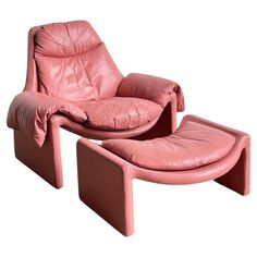 pink leather lounge chair and ottoman with footstool