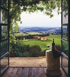 a bottle of wine sitting on top of a wooden table