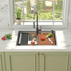 the kitchen sink is clean and ready to be used as a cutting board for vegetables