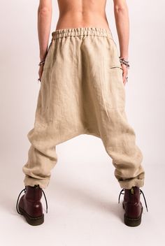 Update your streetwear with the linen harem pants women. These Foll Loose fitting pants women feature a low waisted construction, front asymmetric button closure. The pants have two side pockets for convenient storage. This linen clothing is designed to flatter every body type and fit numerous occasions. When we designed thes harem pants we focus on the versatility of each model to make it a perfect match for your favorite accessories and wardrobe pieces. Perfect for slaying in the streets, pair Baggy Beige Linen Harem Pants, Beige Baggy Linen Harem Pants, Non-stretch Beige Cotton Harem Pants, High-waisted Linen Harem Pants For Loungewear, Navy Pants Women, Ankle-length Linen Harem Pants With Pockets, Casual Full-length Linen Harem Pants, Casual Pants Women, Linen Shirt Women