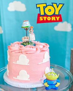 a toy story birthday cake with pink frosting