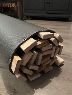 a pile of wood sitting on top of a wooden floor