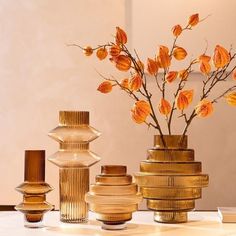 Our Farrah Abstract Amber Decorative Glass Vase Collection brings a conceptual form and modern style to your tabletops and mantelpiece, with their uniquely-shaped designs which have been fashioned from beautiful Amber Glass. Whether you are trying to achieve a impactful look, or simply wanting to exude a abstract feel throughout your spaces, these glass vases will look fantastic displayed in your living or dining room, creating stunning décor feature pieces. The Vase Collection includes two ... Flower Pot Tower, Pillar Vases, Amber Glass Vase, Glass Vases Centerpieces, Tall Glass Vase, Vase Transparent, Vase Collection, Floral Vase, Modern Light Fixtures