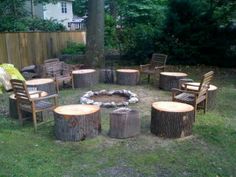 a fire pit surrounded by wooden chairs and logs