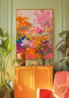 a living room with an orange chair and large painting on the wall above it, along with potted plants