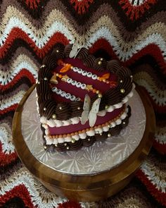 a heart shaped cake sitting on top of a table