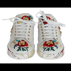 Dolce & Gabbana Gorgeous Brand New With Tags, 100% Authentic Dolce & Gabbana Shoes. Model: Casual Sneakers Material: Leather Color: White With Multicolor Floral Embroidery Detailing Crystal: Multicolor Gold Metal Detailing Rubber Sole Logo Details Made In Italy Luxury Embellished White Sneakers, White Embellished Lace-up Sneakers, Designer White Sneakers For Spring, Casual White Embellished Sneakers, Designer Lace-up Summer Sneakers, Designer Lace-up Sneakers For Summer, Shoes Model, Dolce Gabbana Shoes, Embroidery Detailing