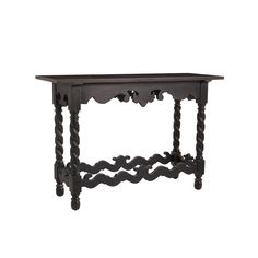 an old wooden table with ornate carvings on the top and bottom, against a white background