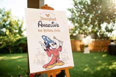 a sign for disneyland's angelin's 2nd birthday party in the grass