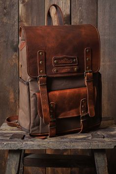 HIKI BAG*LAPTOP BACKPACK*HİKİNG BAG*BİRTHDAY GİFT*BOYFRIEND GİFT * Made of waterproof fabric and genuine leather. * Size: 17,3 H x 10,6 L x 4,3 W / 44x 27x 11cm * There are special drinkers for thermos and flask on the side of the bag. * The leather cover gives the bag an elegant look and increases its durability. *The canvas fabric, which is waxed with beeswax and paraffin to make it waterproof, creates patterns when folded and offers a rich look. * You can use and personalize this bag with con Brown Bags With Leather Backing For Adventure, Brown Leather-backed Bags For Adventure, Rectangular Brown Camera Bag For Outdoor, Brown Rectangular Camera Bag For Outdoor, Brown Coated Canvas Standard Backpack, Rugged Rectangular Backpack With Leather Backing, Rectangular Travel Backpack With Waxed Finish, Brown Rectangular Backpack With Waxed Finish, Rectangular Brown Waxed Backpack