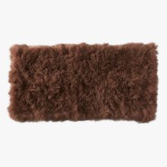 a brown shaggy rug on a white background