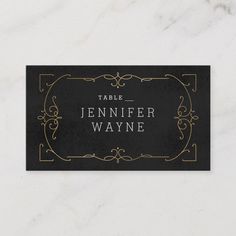 a black and gold business card with the words table name on it, in white lettering