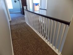 the hallway is clean and ready to be used as a home decorating area for guests