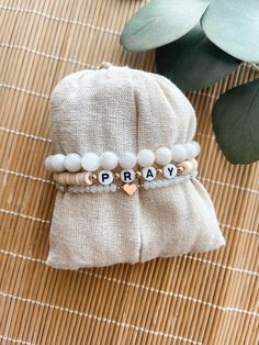 Custom neutral bracelet stack This bracelet stack is super cute and trendy. You are able to choose the word that you want and make it personal. Such a cute expression of faith. Please choose the color for the word bracelet. If you need a size other than 7 please leave that in the box too. The average size for a female is 7 inches. To measure your wrist: *Take a piece of yarn and measure around your wrist with the yarn and then measure the yarn in inches to get your wrist measurement. These are d Bachelorette Beaded Bracelets, Inspirational Handmade Bracelets For Everyday, Inspirational Handmade Bracelet For Everyday, Adjustable Stackable Wristband As Gift, Inspirational Handmade Name Bracelet For Everyday, Everyday Inspirational Handmade Name Bracelet, Inspirational Handmade Name Bracelet, Inspirational Adjustable Stretch Bracelet, Inspirational Adjustable Stretch Bracelet For Everyday