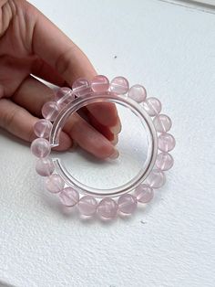 ❤️Add a touch of elegance and tranquility to your jewelry collection with this beautiful Rose Quartz bracelet. Crafted from smooth, round beads, this bracelet captures the gentle pink hue of Rose Quartz, known as the stone of universal love. ▫️Material: Genuine Rose Quartz ▫️Bead Size: 10mm ▫️Bracelet length: fits 16cm+ = 6.3 inches ✅Care Instructions: ✔️Keep away from harsh chemicals and prolonged exposure to water. ✔️Clean with a soft cloth to maintain its natural shine. 🔺Please note:  ☑️All photos are taken in the natural daylight with no filter applied. ☑️Each bead in the bracelet is unique. The presence of dark spots, white lines and yellow hues add to the natural beauty of your bracelet, making it one-of-a-kind. These characteristics are inherent to all genuine natural gemstones, re Elegant Hand-strung Rose Quartz Crystal Bracelet, Elegant Rose Quartz Crystal Bracelet For Meditation, Elegant Beaded Bracelets For Meditation, Elegant Rose Quartz Crystal Bracelet With Round Beads, Round Rose Quartz Crystal Bracelet, Round Rose Quartz Beaded Bracelets With 8mm Beads, Yellow Hues, Rose Quartz Bracelet, Rose Quartz Beads