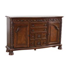 a wooden sideboard with drawers and carvings on the front, along with marble top