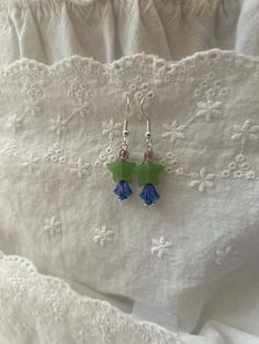 These cute dangle earrings are perfect for any occasion! Made from silver-plated earring hooks and green star beads with blue flower beads. These earrings add the perfect touch green star beads add the perfect touch. Sterling Silver Beaded Earrings, Beaded Earrings Aesthetic, Cute Beaded Earrings, Blue Star Earrings, Silver Bead Earrings, Jewelry Making Business, Star Beads, Earrings Dangling, Earrings Aesthetic