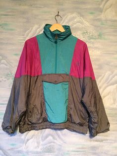 "Gray -Pink- Turquoise blue Windbreaker Sport Hipster Jacket Medium to Large Size Estimated size: M/L Measurements (lying flat): Length: 25.5\" / 65 cm Hips: 19,6\" / 50 cm elastic Width: 24,8\" / 63 cm (under arms down) Sleeve: 18,5\" / 47 cm Shoulders: 29,1\" / 74 cm Please check measurements to insure a proper fit. Remember to allow yourself some extra room for movement. You can compare these with something from your closet that fits you well. This jacket will come to you freshly laundered an Retro Green Long Sleeve Windbreaker, Retro Green Windbreaker, Retro Green Color Block Outerwear, Vintage Blue Color Block Outerwear, Green Color Block Windbreaker For Winter, Retro Pink Outerwear For Outdoor, Retro Pink Long Sleeve Windbreaker, Retro Pink Windbreaker For Fall, Vintage Pink Windbreaker For Fall