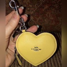 *Nwt-Coach-Heart Bag Charm/Coin Purse-Keychain-Light Yellow-$128: *Product Details: Crossgrain Leather Color: Light Yellow Zip Closure Silver-Tone Hardware Attached Split Key Ring & Dogleash Clip Fabric Interior Lining 3-1/2" L X 3" H X 0.5" W Style: Cp368 Msrp $128 + Tax *Smoke-Free Home. *Shipped Promptly-Usually The Same Day As Purchased. If Not Possible, Then Item Will Be Shipped Out The Next Available Business Day. Coin Purse Keychain, Purse Keychain, Coach Keychain, Heart Bag, Leather Coin Purse, Love Charms, Coach Accessories, Key Card Holder, Light Yellow