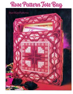 a pink crocheted bag with a cross on it