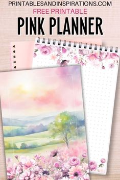 a pink planner with watercolor flowers on it