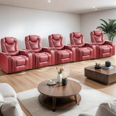 a living room filled with lots of red couches