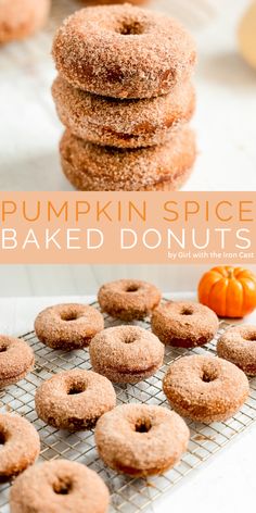 pumpkin spice baked doughnuts stacked on top of each other with the words pumpkin spice baked donuts above them