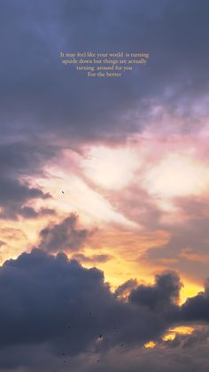 the sky is filled with clouds and some birds flying in front of it at sunset