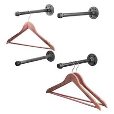 three wooden clothes hangers with metal bar ends