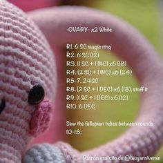 a pink crocheted stuffed animal with numbers on it's face and back