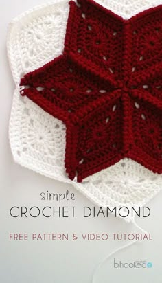 the crochet star is on top of a white doily with red trim